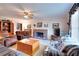 Comfortable living room with a brick fireplace and cozy seating arrangements at 3740 Laurel Brook Way, Snellville, GA 30039