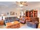Spacious living room with neutral tones, built-in bookshelves, and comfortable seating at 3740 Laurel Brook Way, Snellville, GA 30039
