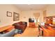 Cozy living room with brown couch, television, and wooden desk at 3740 Laurel Brook Way, Snellville, GA 30039