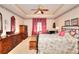 Comfortable main bedroom with floral bedding, ceiling fan and furniture set at 3740 Laurel Brook Way, Snellville, GA 30039