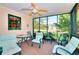 Relaxing screened porch with comfortable seating and views of the backyard at 3740 Laurel Brook Way, Snellville, GA 30039