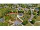 Aerial view of a home on a spacious lot surrounded by mature trees, highlighting its serene setting at 4030 Scenic View Ct, Cumming, GA 30028