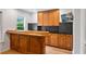 Entertainment area featuring a wooden bar, cabinets, and granite countertops at 4030 Scenic View Ct, Cumming, GA 30028