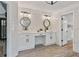 Bright bathroom with double sink, marble walls, and spacious area at 4030 Scenic View Ct, Cumming, GA 30028