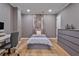 Cozy bedroom with wood-look floors and neutral walls, a perfect and relaxing getaway at 4030 Scenic View Ct, Cumming, GA 30028