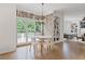 Bright breakfast nook with large windows, wood paneling, and a view of the backyard at 4030 Scenic View Ct, Cumming, GA 30028