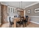Dining room showcasing a wooden table, modern chandelier, and decorative wall accents at 4030 Scenic View Ct, Cumming, GA 30028