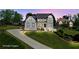 Charming two-story home with manicured lawn and inviting front porch on a well landscaped lot at 4030 Scenic View Ct, Cumming, GA 30028