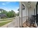 Inviting front porch with rocking chairs, perfect for enjoying the neighborhood views at 4030 Scenic View Ct, Cumming, GA 30028