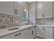 Kitchen nook featuring gray cabinets and mosaic backsplash at 4030 Scenic View Ct, Cumming, GA 30028