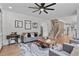 Cozy living room with staircase, comfortable seating, and stylish decor at 4030 Scenic View Ct, Cumming, GA 30028