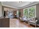 Bright main bedroom features hardwood floors, sitting area, and four-poster bed in a stylish and comfortable space at 4030 Scenic View Ct, Cumming, GA 30028