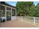 Deck with white railing with a lawn and fence in the background at 4030 Scenic View Ct, Cumming, GA 30028