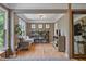 Sitting room with a sofa, shelving unit, a hardwood floor, and light-colored walls at 4030 Scenic View Ct, Cumming, GA 30028