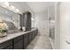 Modern bathroom offers a walk-in shower, dual sinks, and a vanity at 4815 Amble Trce, Cumming, GA 30040