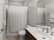 Neutral bathroom featuring a shower and vanity with sink and fixtures at 4815 Amble Trce, Cumming, GA 30040
