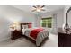 Cozy bedroom featuring a ceiling fan and a window with lots of natural light at 4815 Amble Trce, Cumming, GA 30040