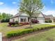 Beautiful brick home with lovely landscaping, a manicured lawn, and a charming entrance makes for great curb appeal at 4815 Amble Trce, Cumming, GA 30040