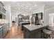 Well-appointed kitchen featuring granite countertops, stainless steel appliances, an island and lots of cabinet space at 4815 Amble Trce, Cumming, GA 30040