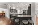 Modern kitchen features a large island with bar seating, sleek cabinetry, and stainless steel appliances at 4815 Amble Trce, Cumming, GA 30040