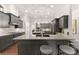 Stylish kitchen with an island, stainless steel appliances, custom backsplash, and a functional design at 4815 Amble Trce, Cumming, GA 30040