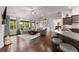 Open concept living area blends kitchen and living spaces, complete with hardwood floors and ample natural light at 4815 Amble Trce, Cumming, GA 30040