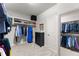 Spacious walk-in closet with shelving and hanging racks at 4815 Amble Trce, Cumming, GA 30040