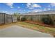 The backyard includes a concrete patio and a fenced in yard at 6595 Story Cir, Norcross, GA 30093
