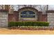 A welcoming Story Farms community sign surrounded by vibrant landscaping at 6595 Story Cir, Norcross, GA 30093