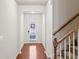 Inviting entryway with hardwood floors and an arched doorway leading to the home's interior at 6595 Story Cir, Norcross, GA 30093