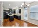 Bright kitchen with black appliances, breakfast area, and access to outdoor space at 6595 Story Cir, Norcross, GA 30093