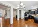 Open-concept living space featuring a kitchen with an island, living area with fireplace, and staircase at 6595 Story Cir, Norcross, GA 30093