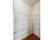 Spacious pantry with white wire shelving and hardwood flooring for optimal storage at 6595 Story Cir, Norcross, GA 30093