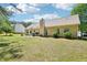 Beautiful backyard featuring a well-manicured lawn and partial shade, perfect for relaxing or entertaining guests at 20 Queensland Ln, Covington, GA 30016