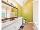 Bright bathroom featuring a double vanity, shower, and tub; perfect for relaxation and convenience at 20 Queensland Ln, Covington, GA 30016