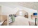Large bonus room featuring neutral carpet, lots of light, and a comfortable seating area at 20 Queensland Ln, Covington, GA 30016