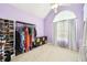 Bright closet featuring shelves and rack for clothes and shoes with natural light from a large window at 20 Queensland Ln, Covington, GA 30016