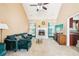 Spacious living room with a fireplace, vaulted ceiling, and large windows with lots of natural light at 20 Queensland Ln, Covington, GA 30016