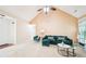Spacious living room with a fireplace, vaulted ceiling, and large windows with lots of natural light at 20 Queensland Ln, Covington, GA 30016
