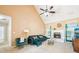 Spacious living room with a fireplace, vaulted ceiling, and large windows with lots of natural light at 20 Queensland Ln, Covington, GA 30016