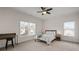 Bedroom with natural light from two windows, a ceiling fan and carpeted floors at 2601 Boulder Way, Woodstock, GA 30188