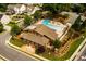 Aerial shot of a community pool with lounge chairs surrounded by manicured landscaping and trees at 2601 Boulder Way, Woodstock, GA 30188