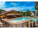 Community pool with lounge chairs, and a building available for parties and activities at 2601 Boulder Way, Woodstock, GA 30188