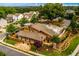 A nice community pool and clubhouse are surrounded by meticulously kept landscaping and mature trees at 2601 Boulder Way, Woodstock, GA 30188