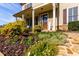 Charming home with a covered front porch, colorful landscaping, and a welcoming entrance at 2601 Boulder Way, Woodstock, GA 30188