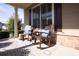 Charming front porch with rocking chairs, pillows, and views of the neighborhood at 2601 Boulder Way, Woodstock, GA 30188
