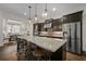 Beautiful kitchen features a large island with seating, pendant lighting, and stainless steel appliances at 2601 Boulder Way, Woodstock, GA 30188