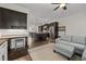 Open floor plan showing a living room connected to a kitchen with dark cabinets and an island at 2601 Boulder Way, Woodstock, GA 30188