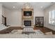 Cozy living room with stone fireplace and hardwood floors at 2601 Boulder Way, Woodstock, GA 30188