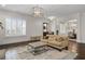 Bright living room with large windows and modern light fixtures at 2601 Boulder Way, Woodstock, GA 30188